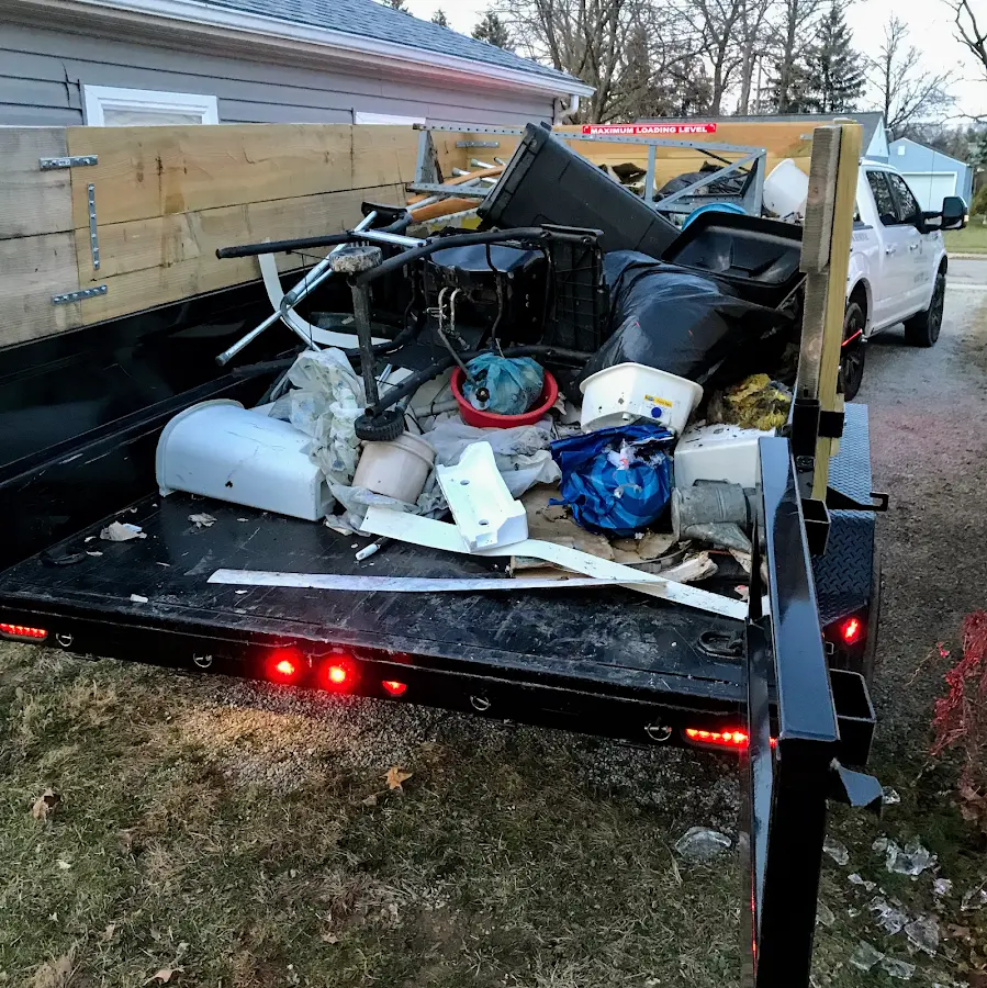 Roll-off dumpster delivered to a residential driveway in Midway South